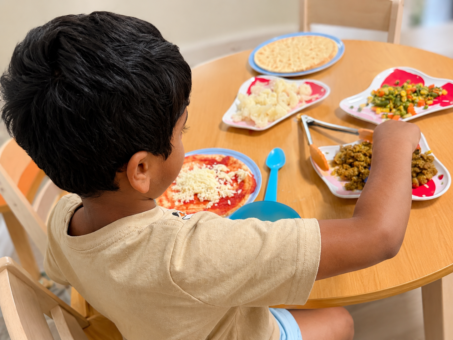 Child participating in a meal and food activity